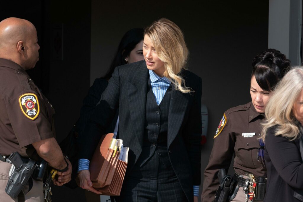 Amber Heard departs the Fairfax County Courthouse, in Fairfax, at the close of another day in her civil trial with Johnny Depp, Wednesday, May 4, 2022. Depp brought a defamation lawsuit against his former wife, actress Amber Heard, after she wrote an op-e