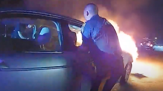 A Heroic New Jersey Police Rescues a Man Trapped in a Burning Automobile Before Heading to Work.